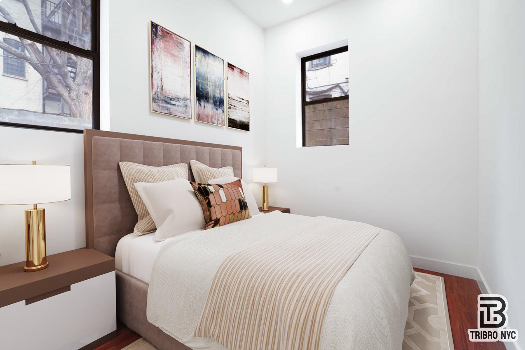 217 South 4th Street, Unit LOFT1 Brooklyn, NY 11211 - Photo 6 of 12 a bed room with a bed and painting on the wall