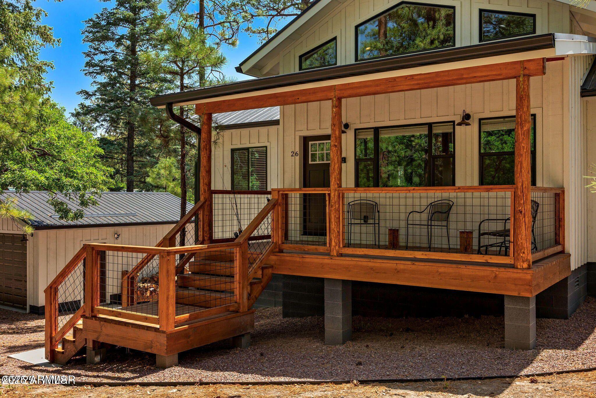 26 County Road 2067 Alpine, AZ 85920 - Photo 12 of 33 a view of a wooden deck with a bench