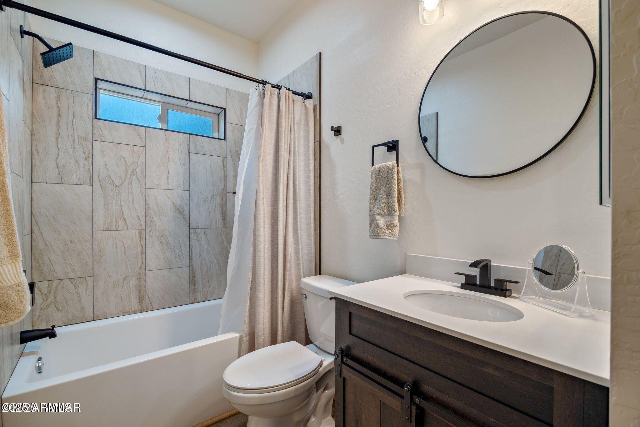 26 County Road 2067 Alpine, AZ 85920 - Photo 20 of 33 a bathroom with a sink a toilet and a mirror