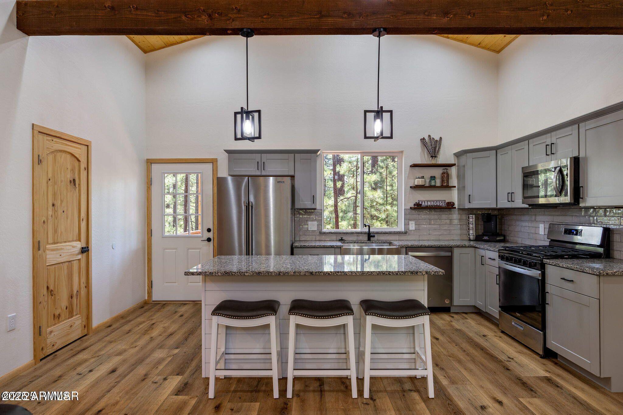 26 County Road 2067 Alpine, AZ 85920 - Photo 5 of 33 a kitchen with cabinets a sink and appliances
