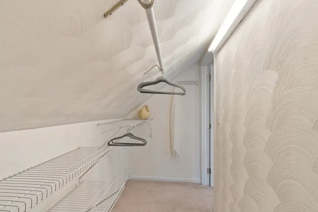 a picture of a bench in a white building