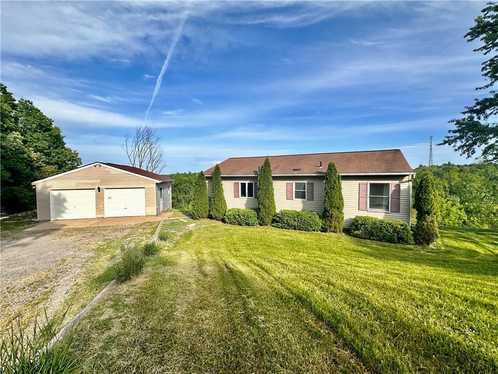 241 Countryview Road Slippery Rock, PA 16057 - Photo 2 of 24 a front view of a house with garden