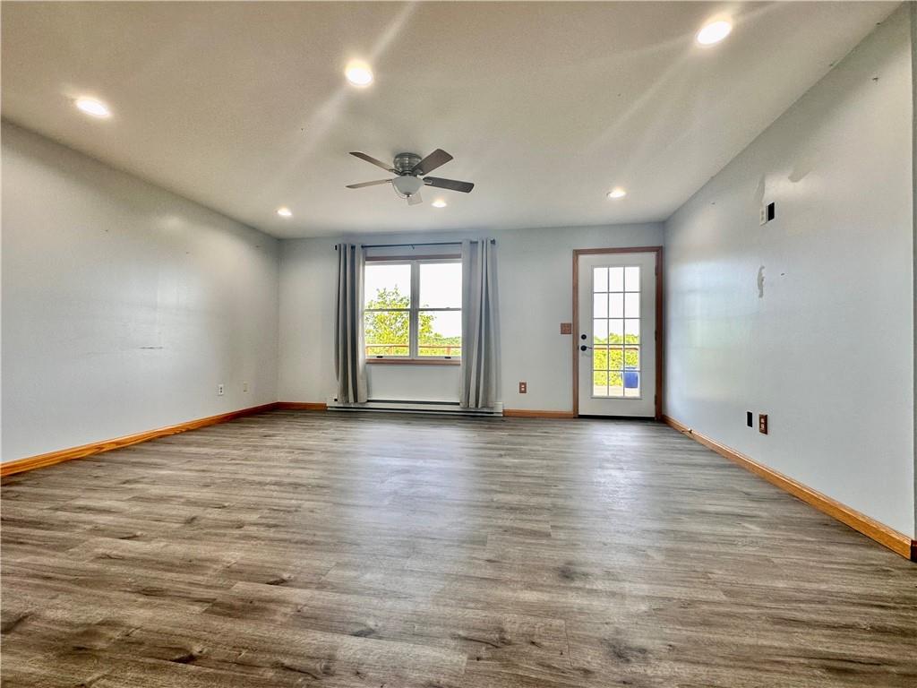 241 Countryview Road Slippery Rock, PA 16057 - Photo 4 of 24 an empty room with wooden floor and windows