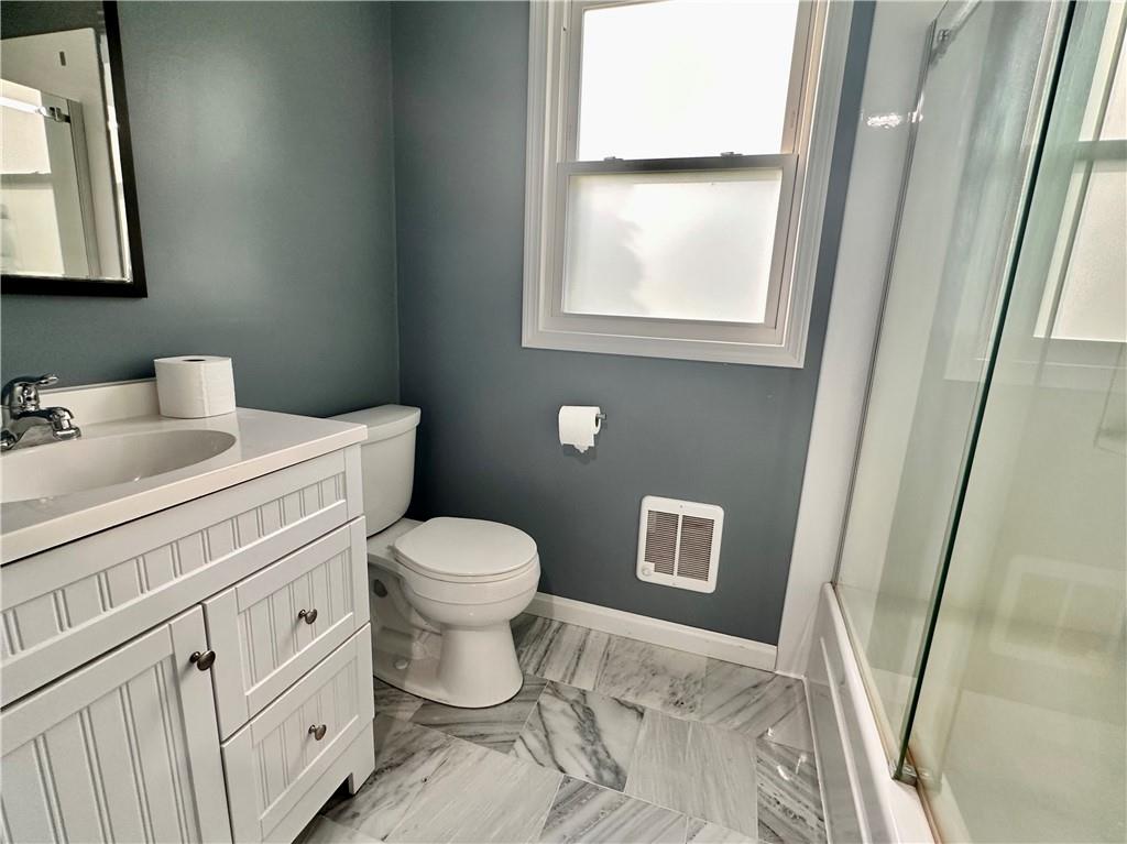 241 Countryview Road Slippery Rock, PA 16057 - Photo 6 of 24 a bathroom with a toilet sink vanity and mirror