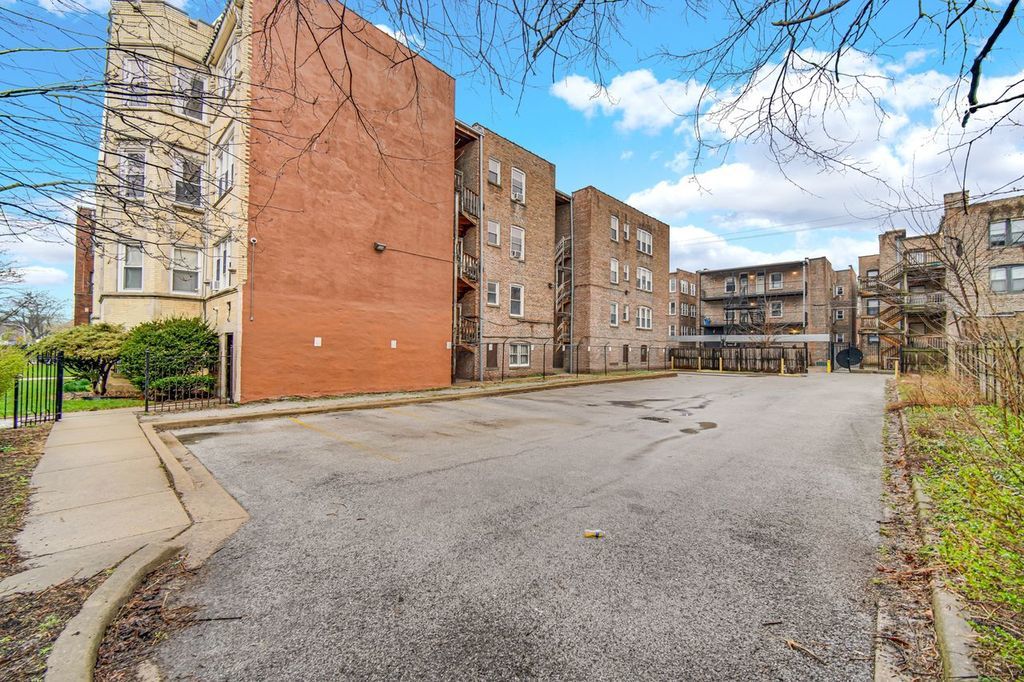7017 South Merrill Avenue, Unit 305 Chicago, IL 60649 - Photo 4 of 20 a view of a building with a road