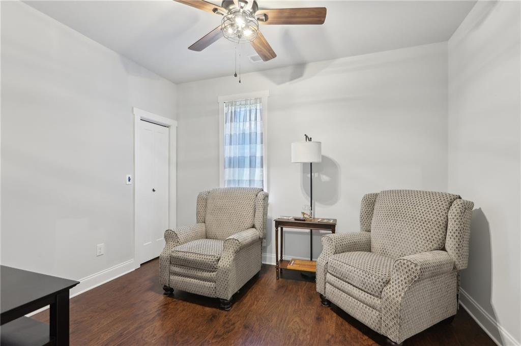 411 Johnson Road Locust Grove, GA 30248 - Photo 20 of 54 a living room with furniture and a chandelier