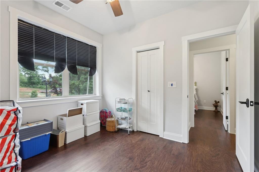 411 Johnson Road Locust Grove, GA 30248 - Photo 23 of 54 a view of a bedroom with furniture and a window
