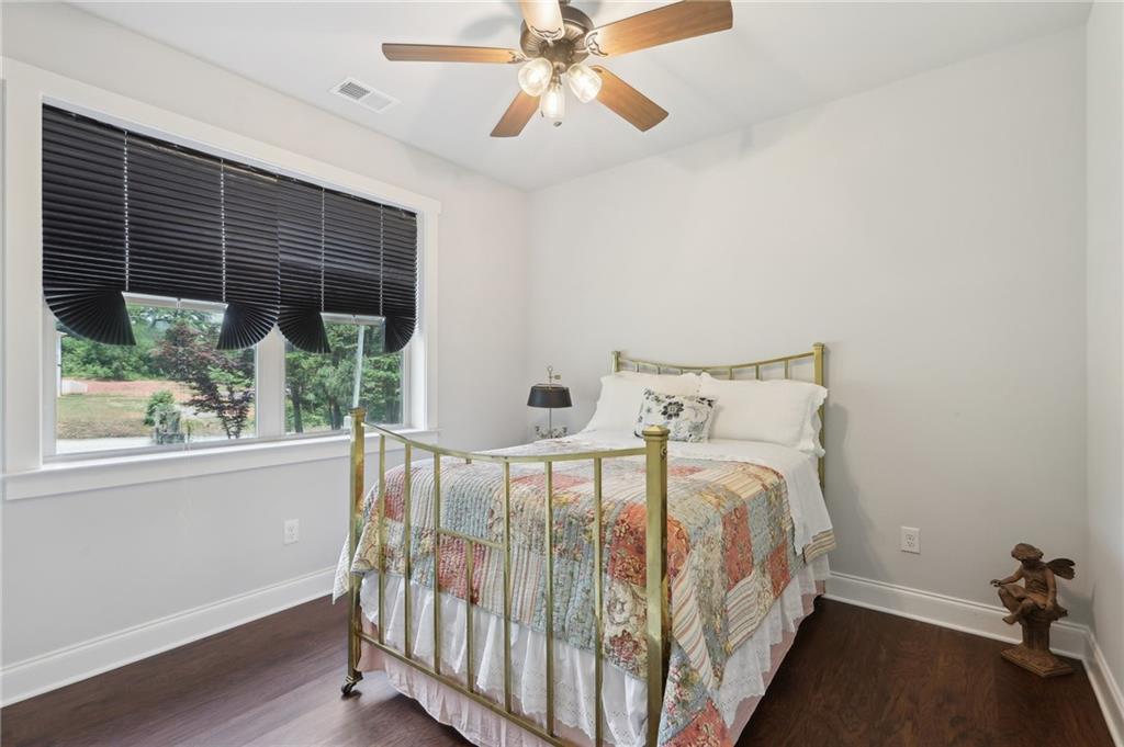 411 Johnson Road Locust Grove, GA 30248 - Photo 24 of 54 a bedroom with a bed and a window