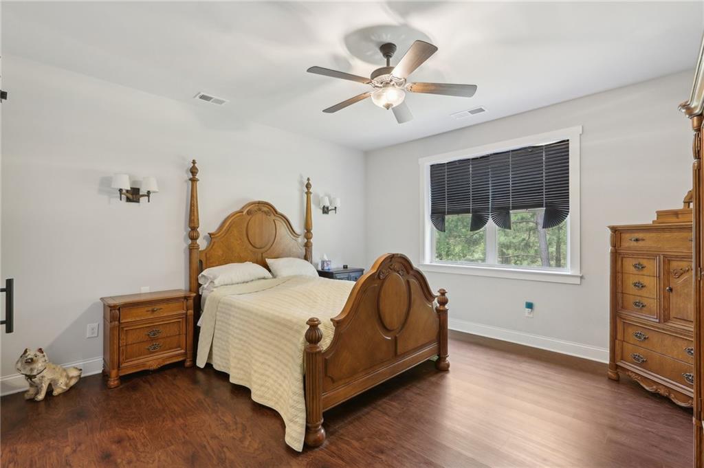 411 Johnson Road Locust Grove, GA 30248 - Photo 27 of 54 a bed sitting in a room next to a window