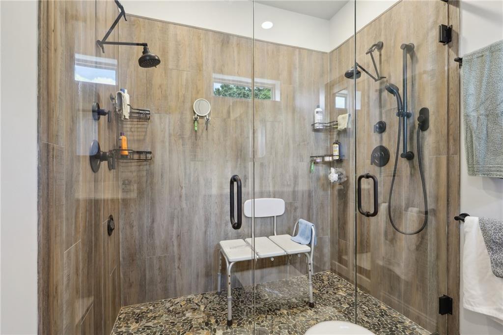 411 Johnson Road Locust Grove, GA 30248 - Photo 31 of 54 a bathroom with a shower and toilet