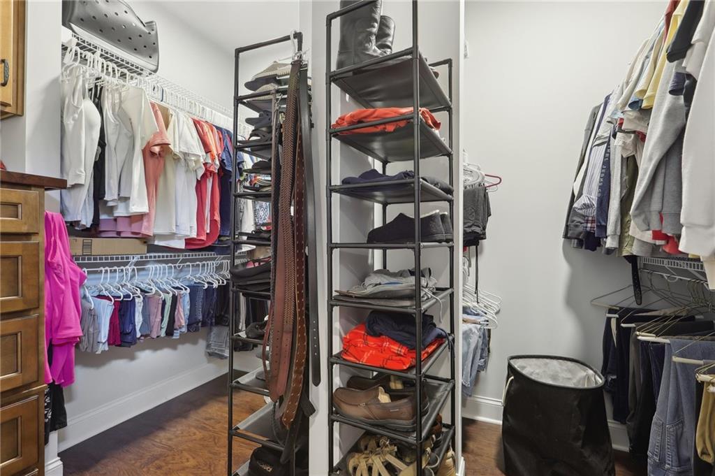 411 Johnson Road Locust Grove, GA 30248 - Photo 32 of 54 a view of walk in closet with clothes and shoes