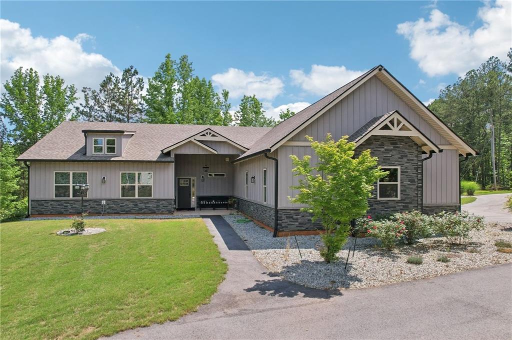 411 Johnson Road Locust Grove, GA 30248 - Photo 41 of 54 a front view of a house with swimming pool having outdoor seating