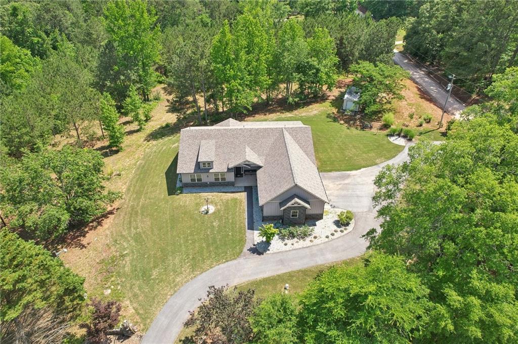 411 Johnson Road Locust Grove, GA 30248 - Photo 43 of 54 an aerial view of a house with a yard