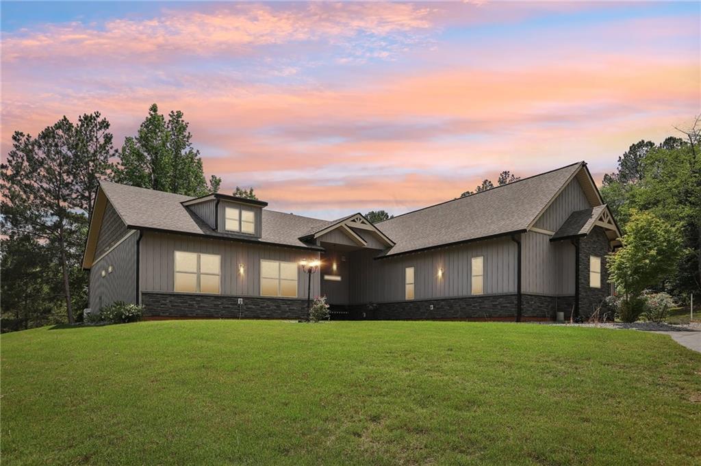 411 Johnson Road Locust Grove, GA 30248 - Photo 52 of 54 a front view of house with yard and green space