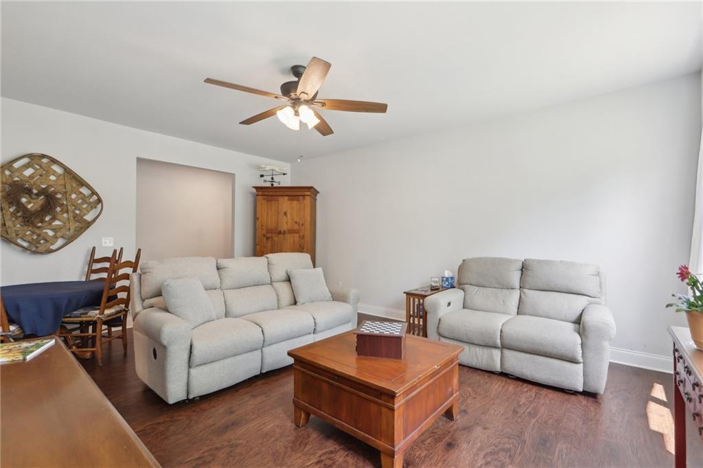 411 Johnson Road Locust Grove, GA 30248 - Photo 7 of 54 a living room with furniture and a couch