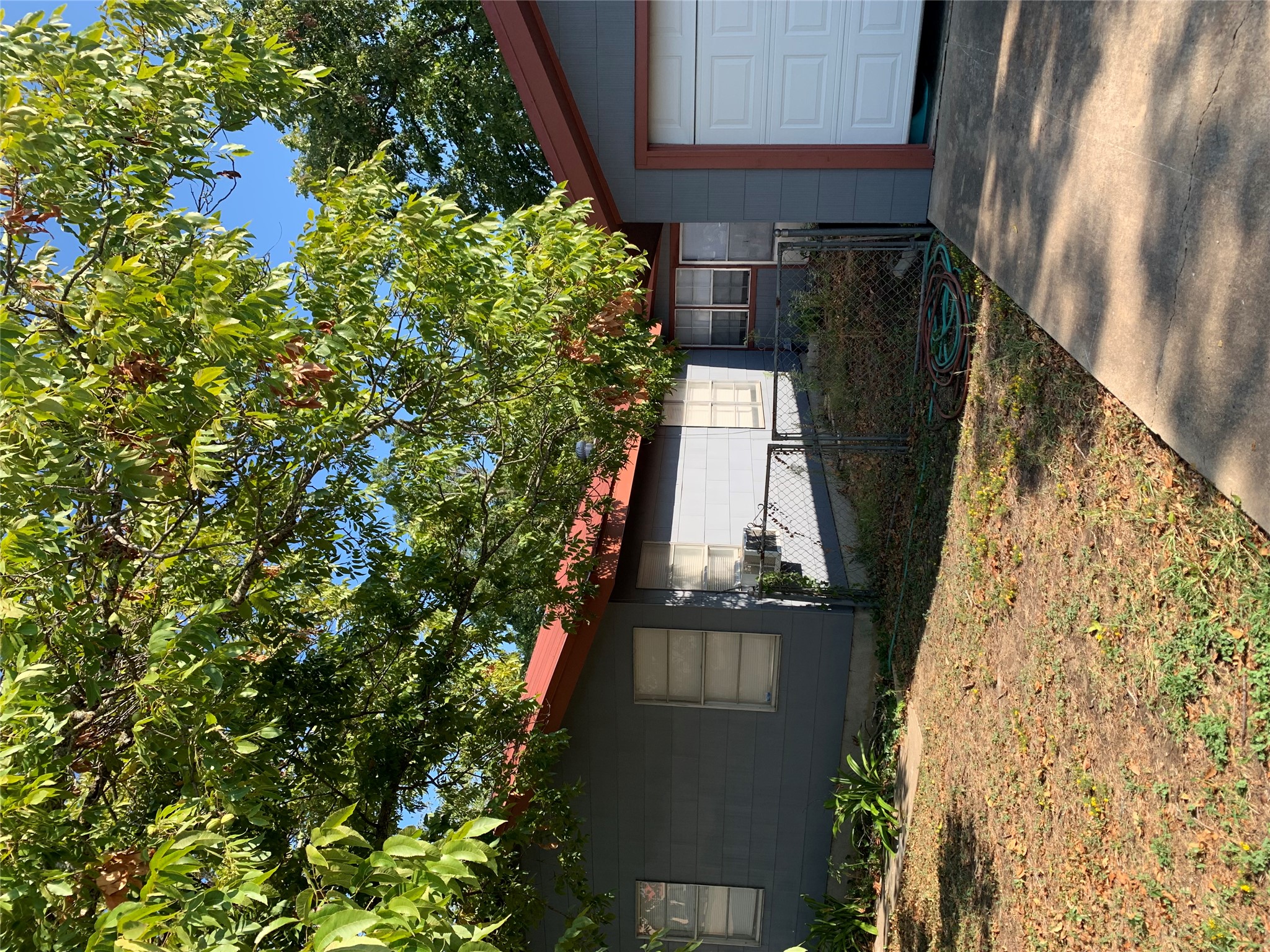 a backyard of a house with lots of green space