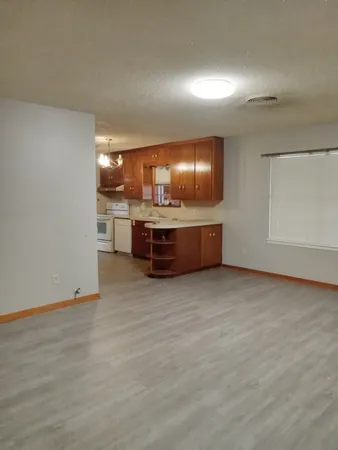 a view of kitchen and kitchen with furniture