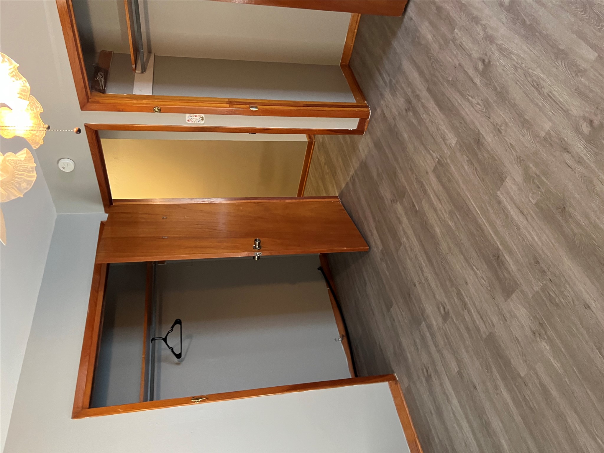 709 West 11th Street Elgin, TX 78621 - Photo 3 of 12 an empty room with wooden floor and a ceiling fan