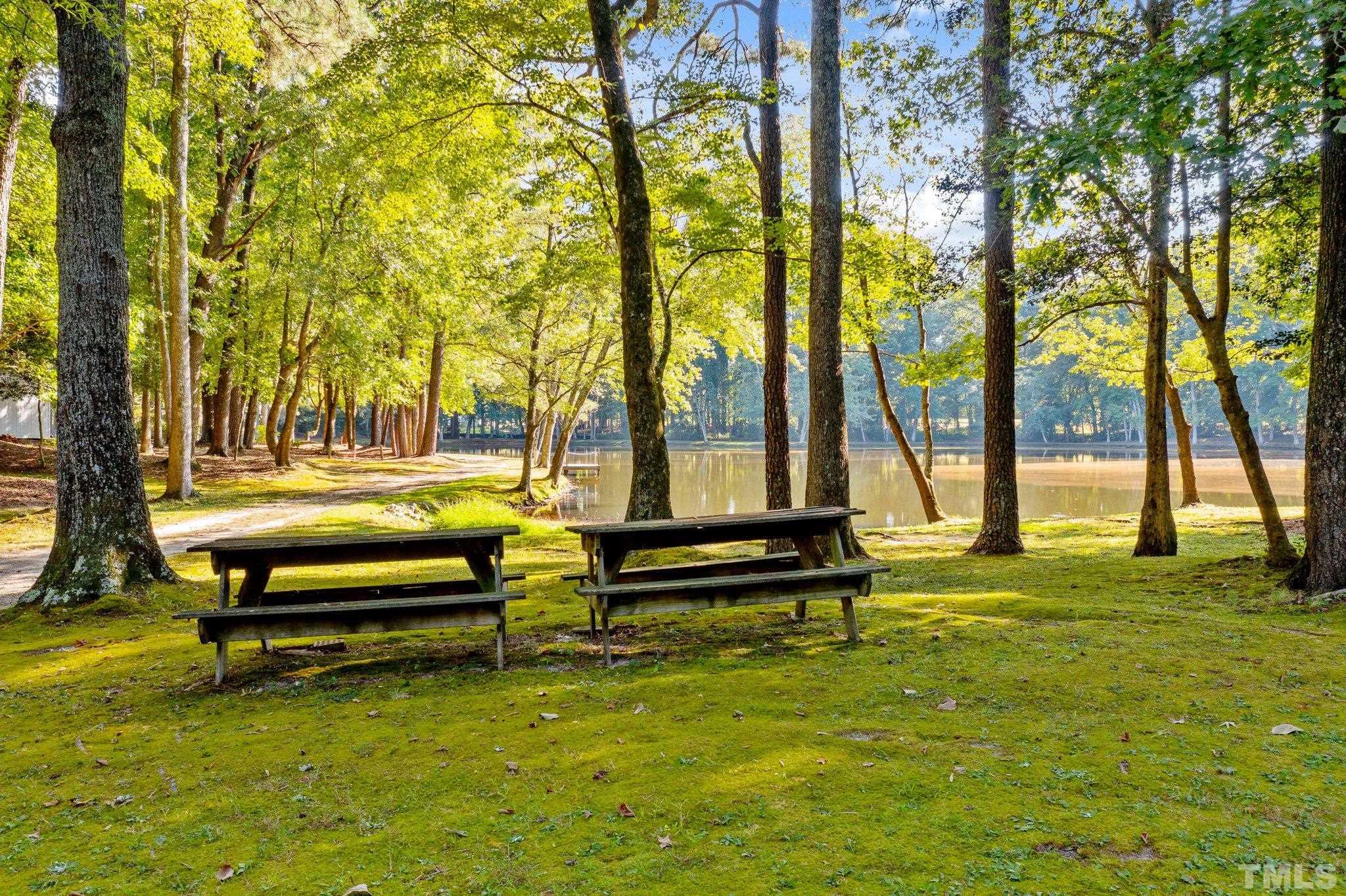 8021 Lockleair Road Zebulon, NC 27597 - Photo 22 of 22 Picnic area near pond and garage