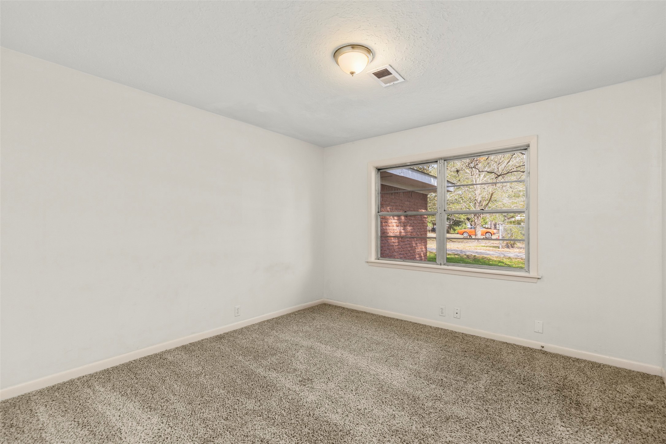 9001 Friendship Road Houston, TX 77080 - Photo 13 of 22 an empty room with windows