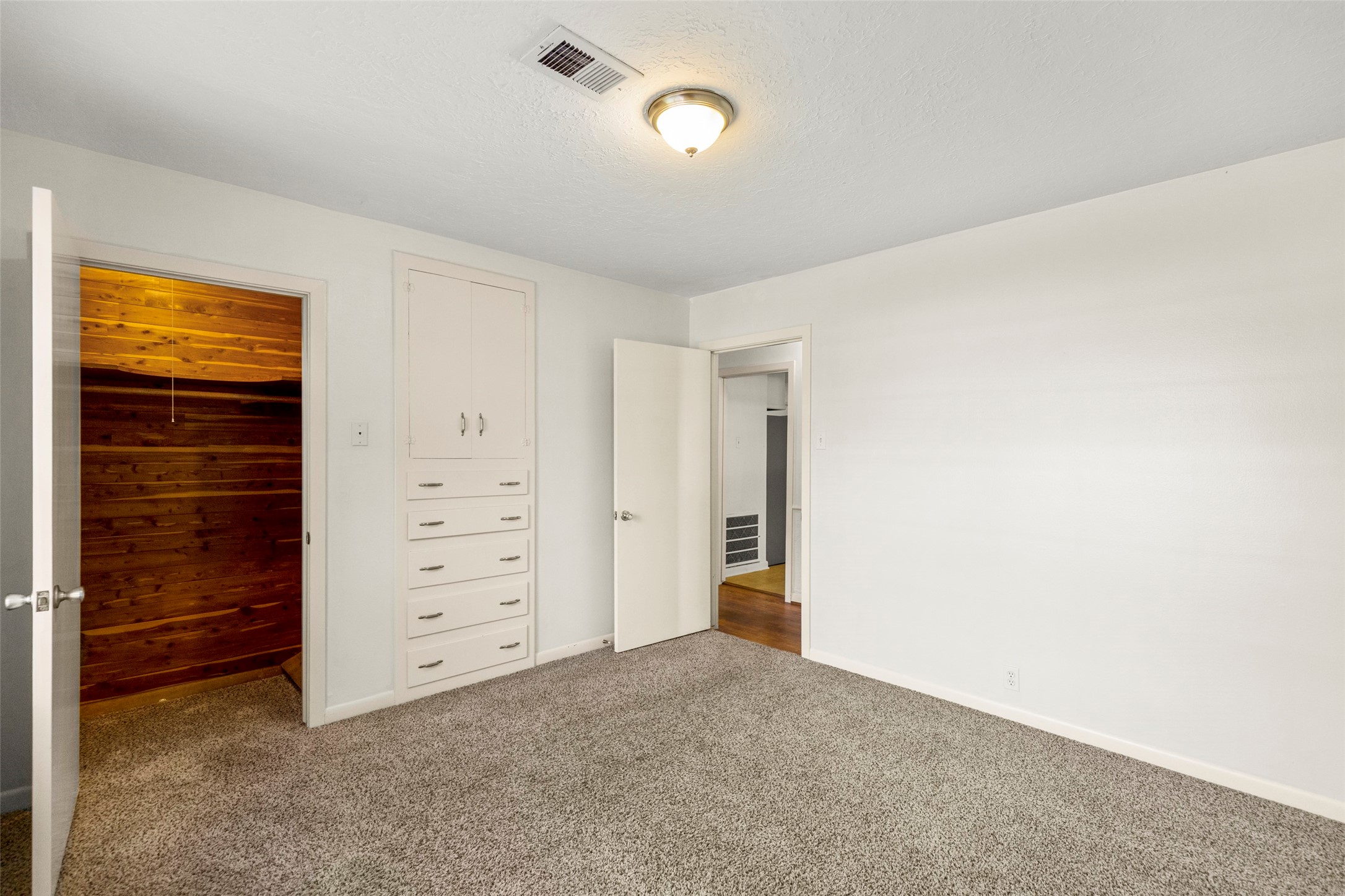 9001 Friendship Road Houston, TX 77080 - Photo 14 of 22 a view of an empty room and cabinet