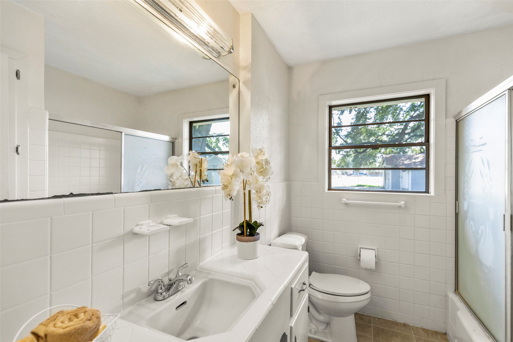 9001 Friendship Road Houston, TX 77080 - Photo 17 of 22 a bathroom with a sink toilet and shower
