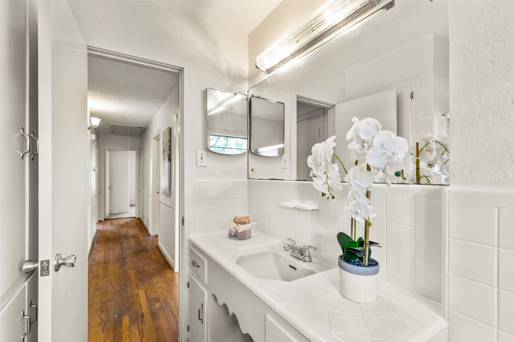 9001 Friendship Road Houston, TX 77080 - Photo 18 of 22 a bathroom with a sink mirror and vanity