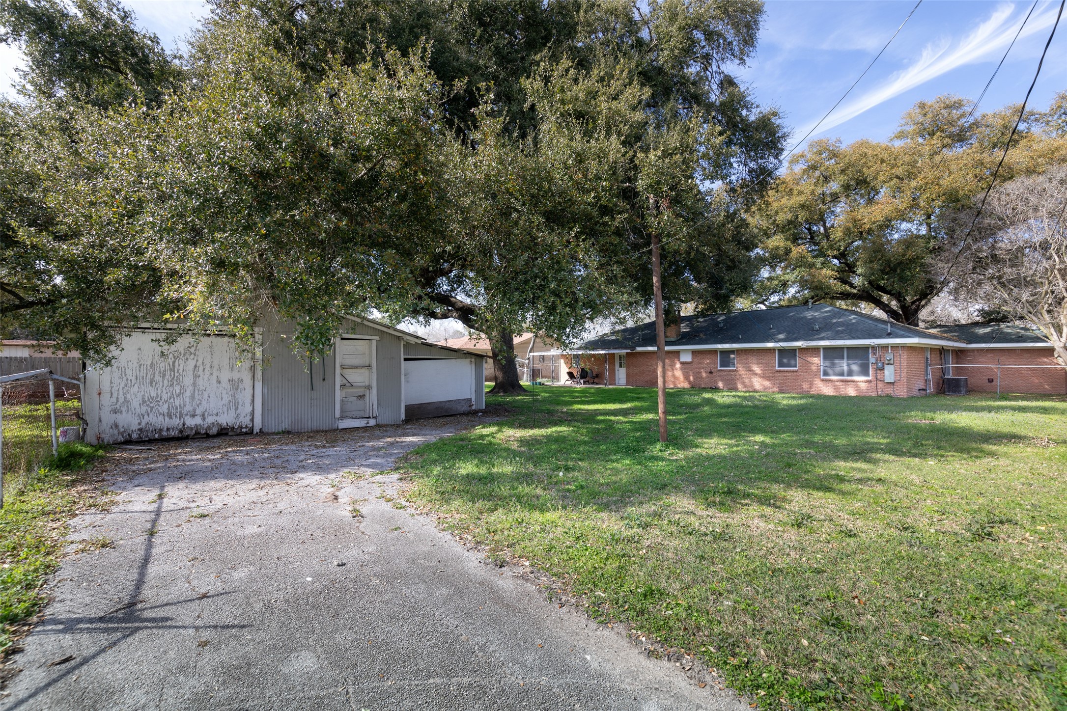 9001 Friendship Road Houston, TX 77080 - Photo 20 of 22 a view of a house with a yard