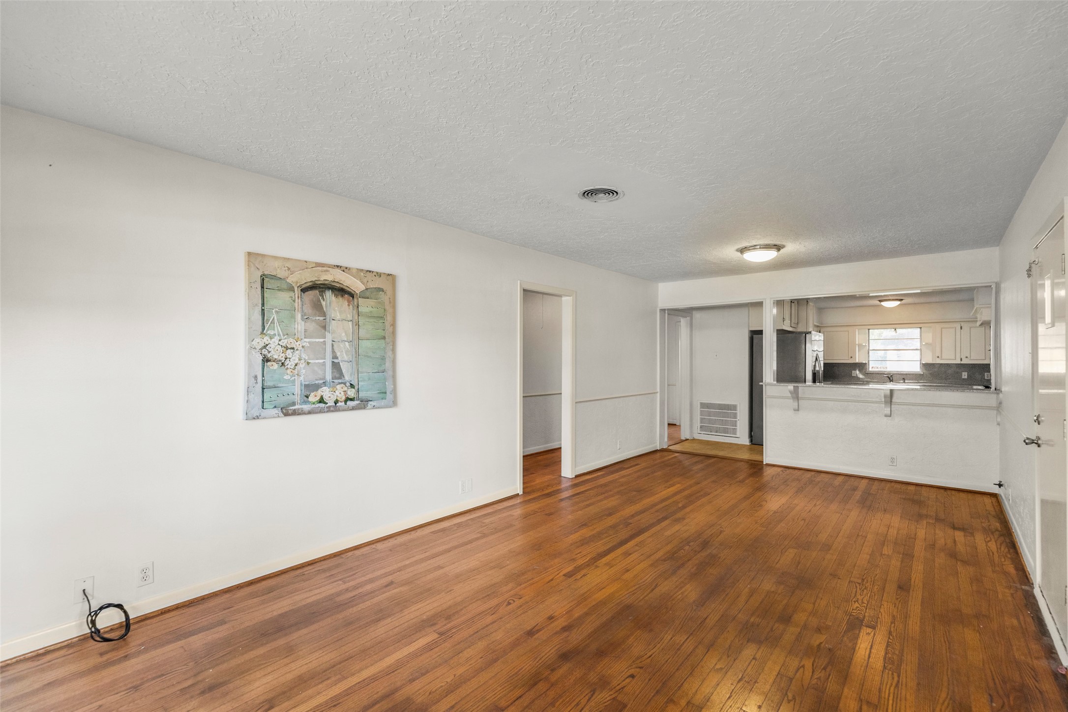 9001 Friendship Road Houston, TX 77080 - Photo 9 of 22 a view of empty room with wooden floor