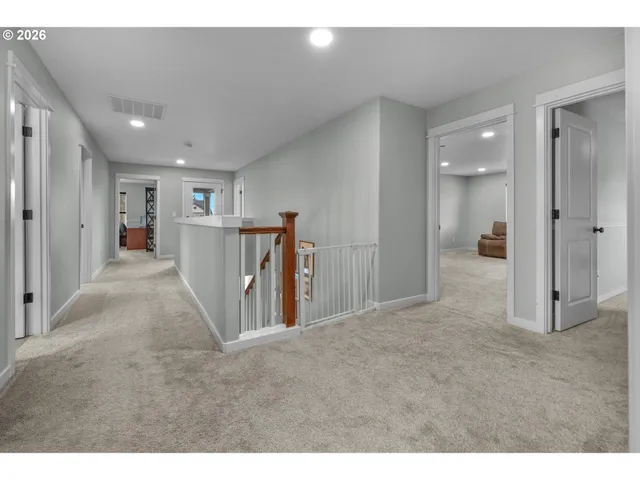 a spacious bedroom with a bed and a fireplace