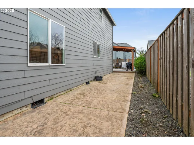 an aerial view of a house with outdoor space