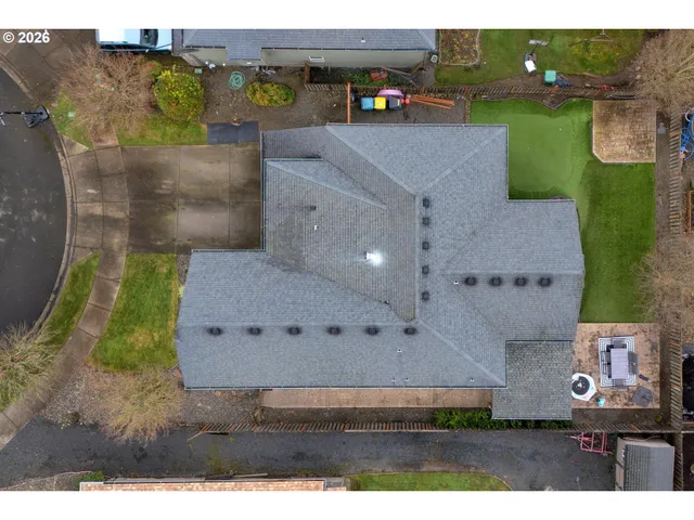a view of a city with lots of residential buildings and mountain view in back