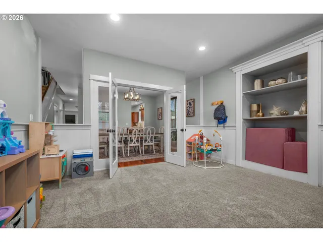 a living room with furniture and gym equipment