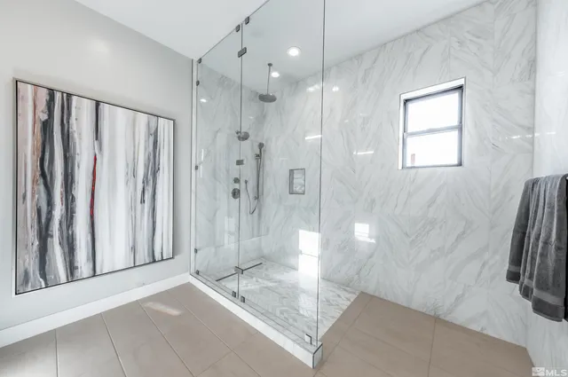 a bathroom with a shower and a tub