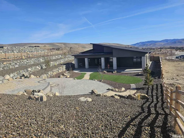a view of a water fountain in front of the house