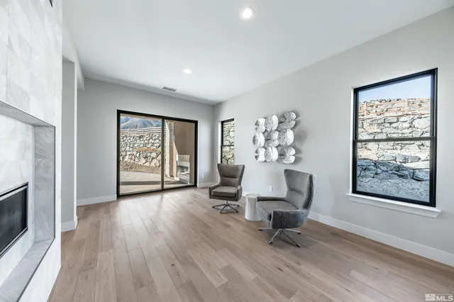 a living room with furniture and a window