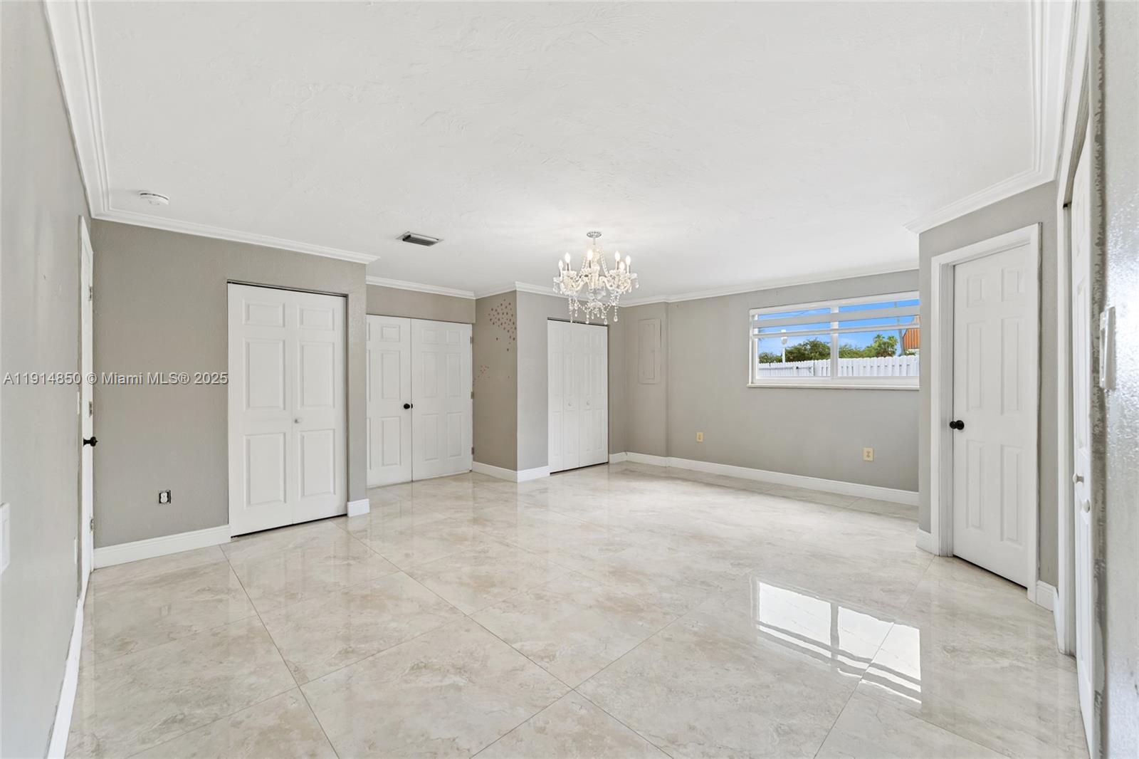 810 East 9th Place, Unit B Hialeah, FL 33010 - Photo 8 of 14 an empty room with windows and closet