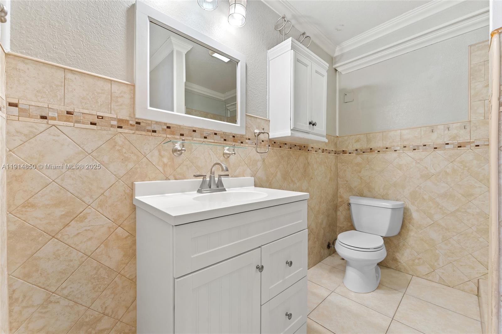 810 East 9th Place, Unit B Hialeah, FL 33010 - Photo 9 of 14 a bathroom with a sink toilet and shower