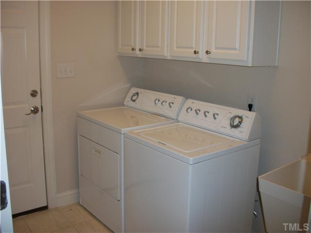 7318 Fontana Ridge Lane Raleigh, NC 27613 - Photo 11 of 23 Nice sized laundry room coming off the garage. Makes an excellent "mud room". Close the door and soften the noise when your washing clothes..
