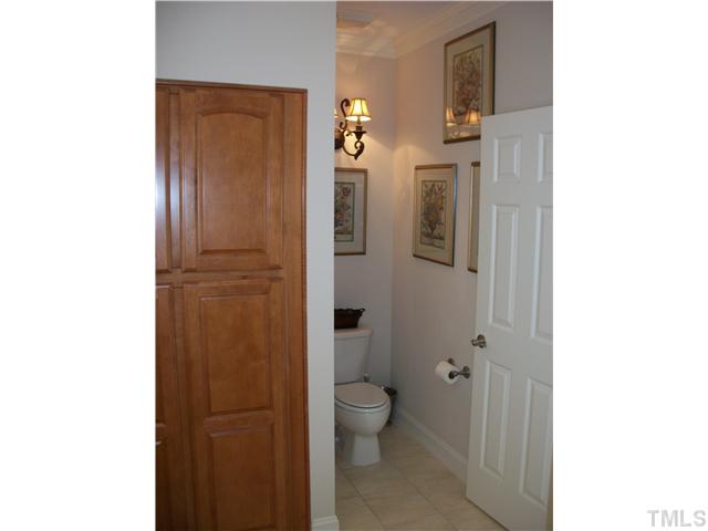 7318 Fontana Ridge Lane Raleigh, NC 27613 - Photo 13 of 23 Another angle of the owners bath suite, here you can see the custom built in linen cabinets and tile floors