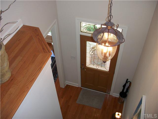 7318 Fontana Ridge Lane Raleigh, NC 27613 - Photo 3 of 23 Stunning vaulted foyer with plant ledge, hardwoods floors with exception to laundry room and owners bathroom. Leaded glass doors throughout the subdivision give each plan their own identity ...