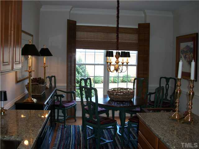 7318 Fontana Ridge Lane Raleigh, NC 27613 - Photo 4 of 23 9' ceilings downstairs except the family room which is 10'. The breakfast nook sits in the front of the home with boxed out windows, chair rail, crown moldings and opens up to the custom designed kitchen