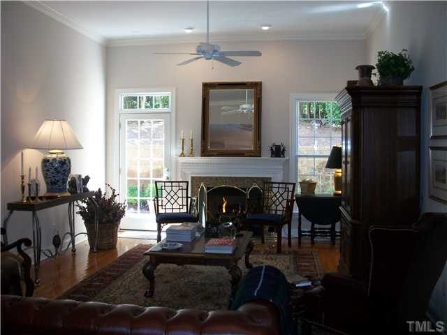 7318 Fontana Ridge Lane Raleigh, NC 27613 - Photo 7 of 23 Raised ceilings in the family room make this light and bright... access to the deck off the family room