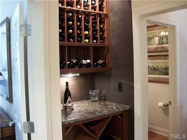 7318 Fontana Ridge Lane Raleigh, NC 27613 - Photo 10 of 23 Custom built and designed wine storage niche with thick granite counter top