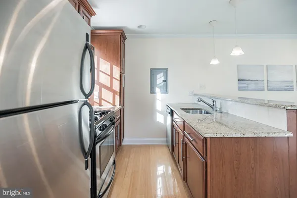 a kitchen with a sink a washer and dryer