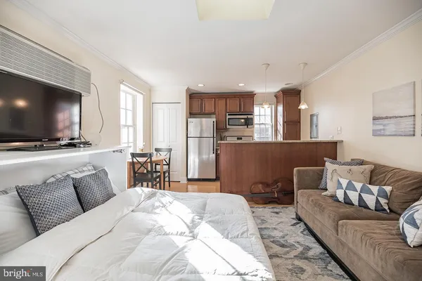 a living room with furniture and a flat screen tv