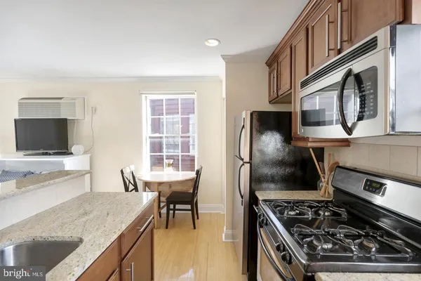 a kitchen with a stove and a microwave
