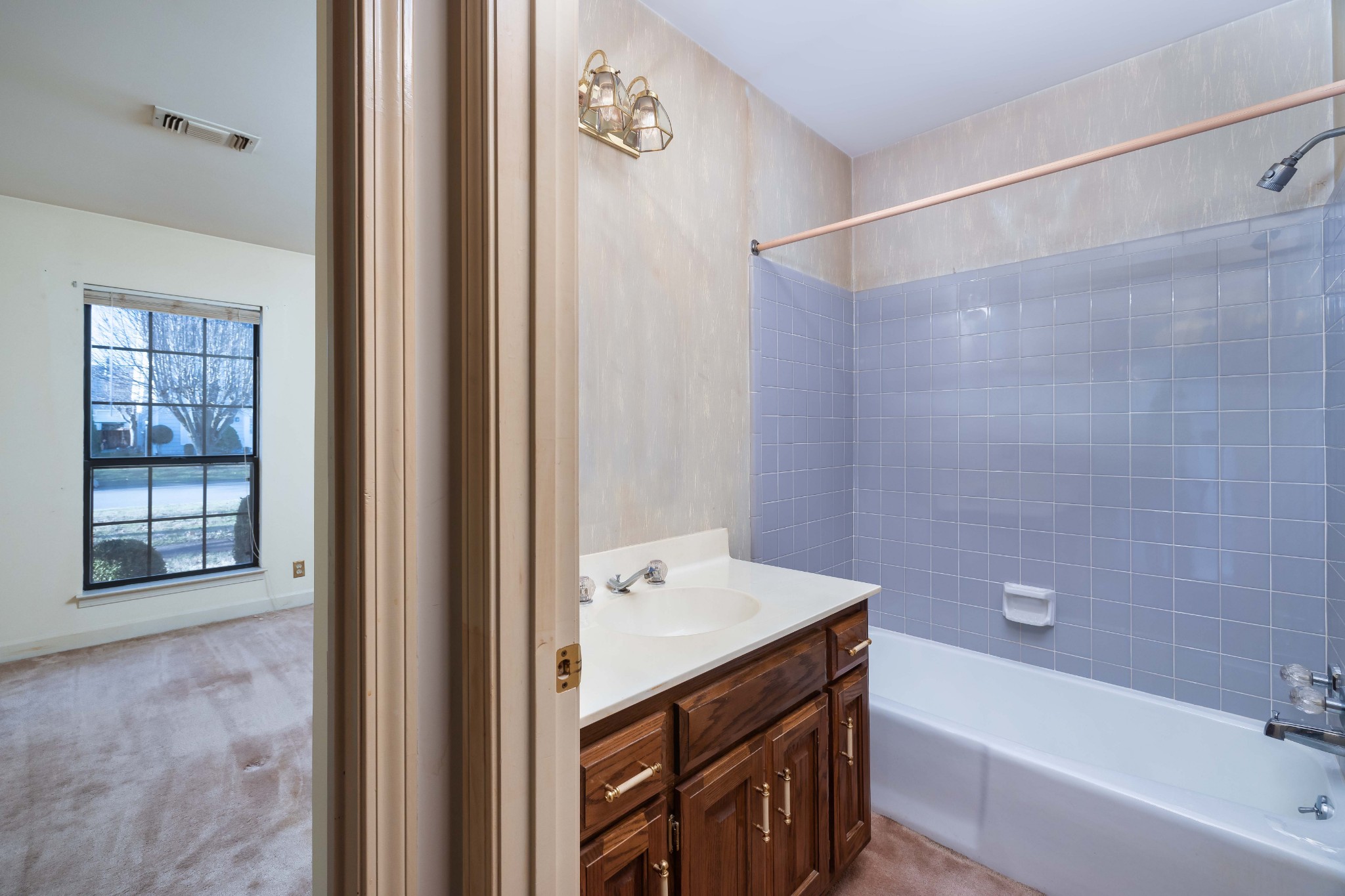 522 General George Patton Road Nashville, TN 37221 - Photo 20 of 27 a bathroom with a bathtub a shower a sink and a window