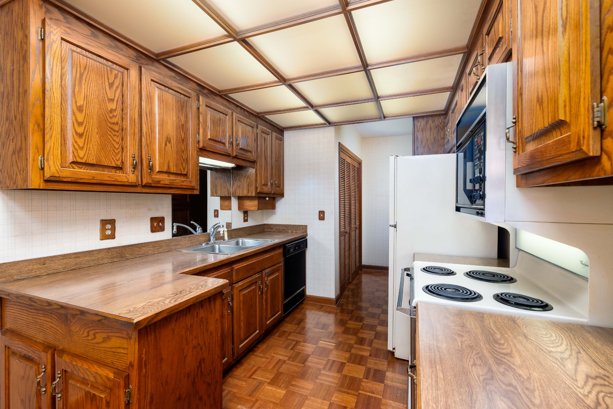 522 General George Patton Road Nashville, TN 37221 - Photo 10 of 27 a kitchen with stainless steel appliances granite countertop a stove a sink dishwasher and a refrigerator with wooden cabinets