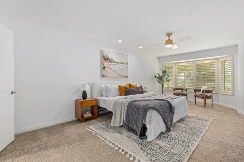 a bed room with bed and window